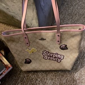 Very cute Authentic Coach Disney Sleeping Beauty.